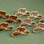 Collection of brown hat-shaped pins